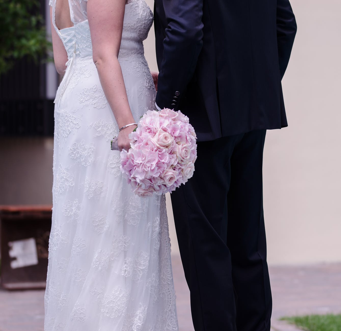 person holding pink rose bouquet